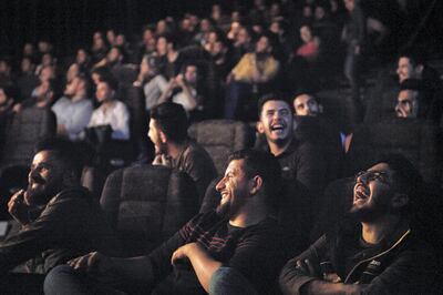 Audience laugh at the weekly shooting of the Albasheer Show, an Iraqi news satire and talk show television program.