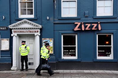 A police officer stands outside a restaurant which was closed after former Russian inteligence officer Sergei Skripal, and a woman were found unconscious on a bench nearby after they had been exposed to an unknown substance, in Salisbury, Britain, March 6, 2018. REUTERS/Toby Melville
