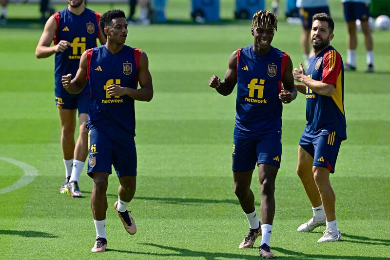 Alejandro Balde, Nico Williams and Jordi Alba take part in a training session at Qatar University in Doha. AFP