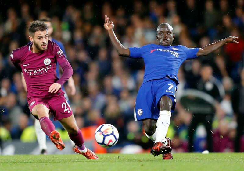 Chelsea's N'golo Kante, right, and Manchester City's Bernardo Silva, left, challenge for the ball during their English Premier League soccer match between Chelsea and Manchester City at Stamford Bridge stadium in London, Saturday, Sept. 30, 2017. (AP Photo/Frank Augstein)