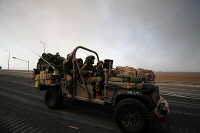 Israeli soldiers patrol on the roads near the border with Gaza. EPA