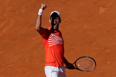 Novak Djokovic of Serbia celebrates a point during the Madrid Open tennis match against Dominic Thiem of Austria in Madrid, Spain, Saturday, May 11, 2019. (AP Photo/Bernat Armangue)