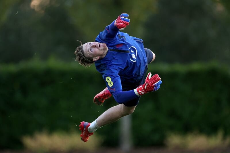 Jordan Pickford dives during a training session at Tottenham Hotspur Training Centre.