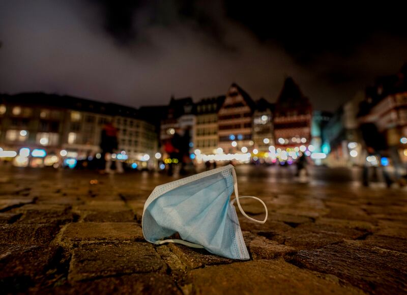 A discarded face mask in Romerberg Square in Frankfurt, Germany. AP Photo