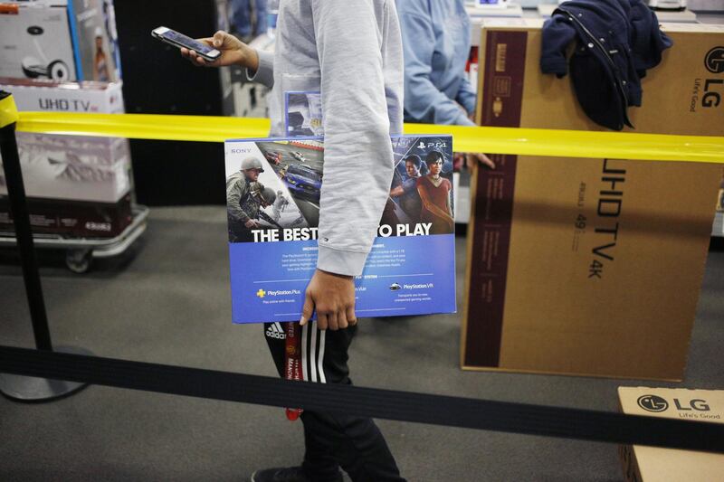 A shopper snags a Sony Playstation 4 in Louisville. Luke Sharrett / Bloomberg