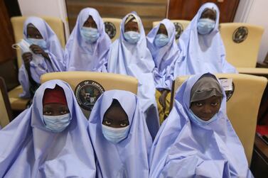 Girls who were kidnapped from a boarding school in the northwest Nigerian state of Zamfara, look on after their release. Reuters