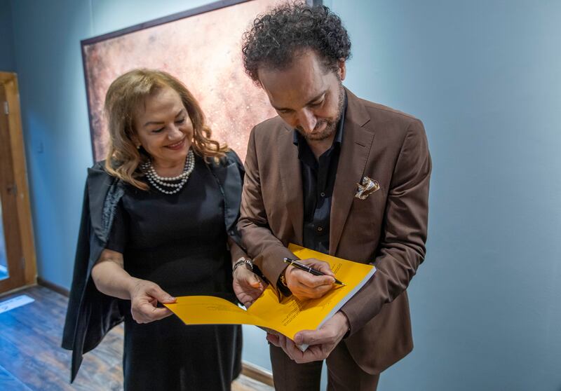 Shamma signs his book A Vision and a Life: Forty Years of Colours, which chronicles his diverse artistry spanning four decades