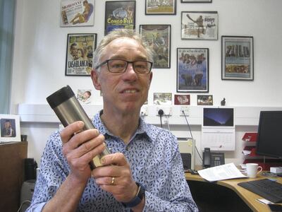                     Professor David Thomas in his office at the University of Oxford with one of the containers used to collect sand samples. Courtsey: Daniel Bardsley                   