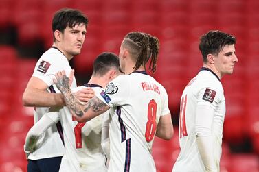 England defender Harry Maguire (L) celebrates scoring the winner against Poland at Wembley. AFP