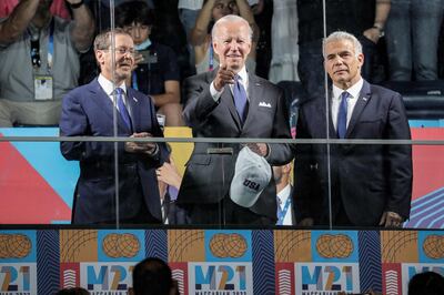 US President Joe Biden with Israel's President Isaac Herzog (L) and caretaker Prime Minister Yair Lapid (R) st the opening ceremony of the Maccabiah Games, in Jerusalem, on July 14. AFP