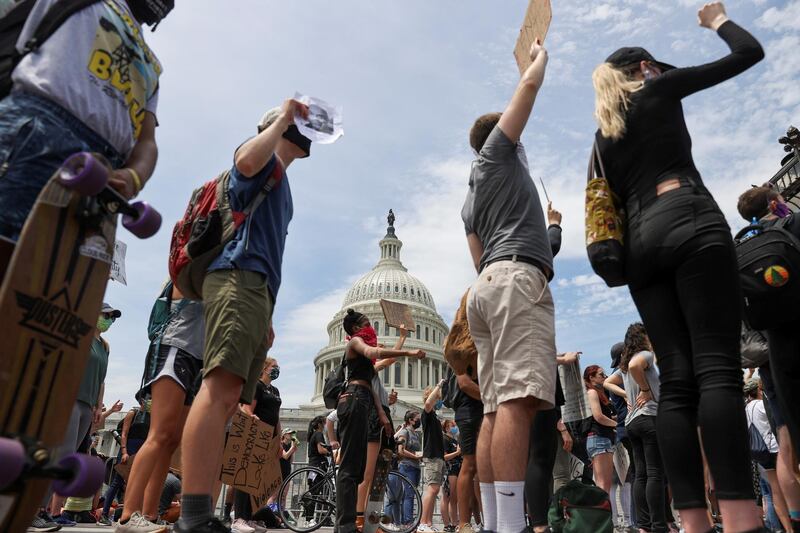 FILE PHOTO: People attend a Black Lives Matter rally, as protests continue over the death in Minneapolis police custody of George Floyd, outside the U.S. Capitol in Washington, U.S., June 3, 2020. REUTERS/Jonathan Ernst/File Photo