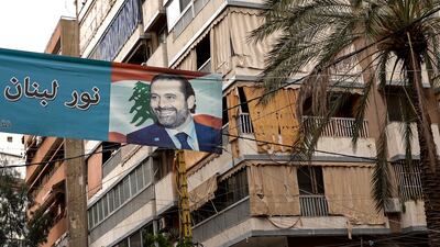 A banner with a picture of Saad Hariri hangs between two buildings in Tarik Jdideh, even though the country's top Sunni politician is not taking part in the parliamentary election on May 15, 2022. Finbar Anderson / The National