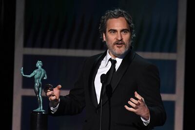 US actor Joaquin Phoenix accepts the award for Outstanding Performance by a Male Actor in a Leading Role during the 26th Annual Screen Actors Guild Awards show at the Shrine Auditorium in Los Angeles on January 19, 2020. / AFP / Robyn Beck
