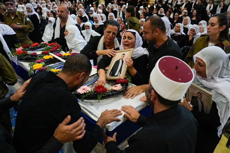 Mourners at the funeral of Druze Israeli Lt Col Salman Habaka in the village of Yanuh Jat, northern Israel. AP 