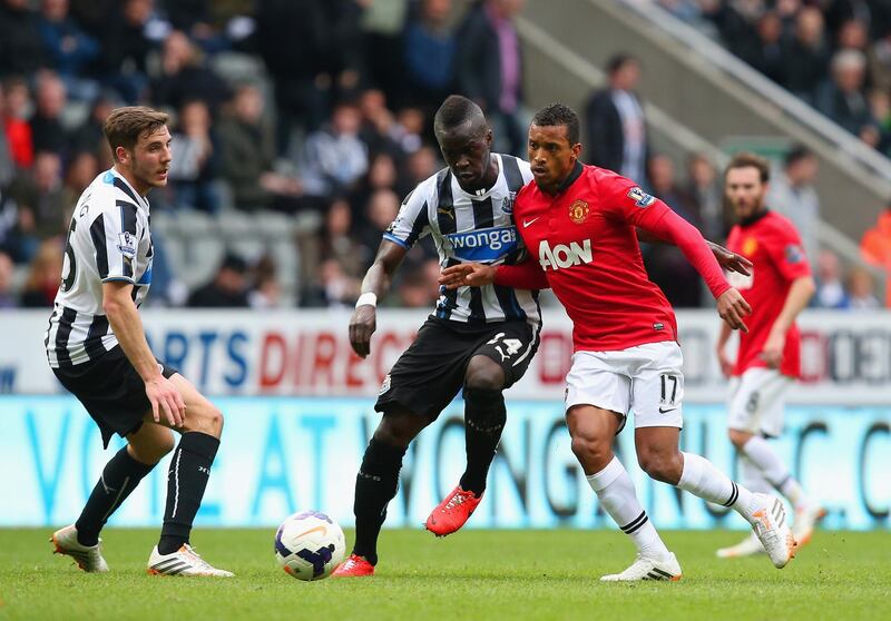 NEWCASTLE UPON TYNE, ENGLAND - APRIL 05:  Cheik Ismael Tiote of Newcastle United and Luis Nani of Manchester United compete for the ball  during the Barclays Premier League match between Newcastle United and Manchester United  at St James' Park on April 5, 2014 in Newcastle upon Tyne, England.  (Photo by Jan Kruger/Getty Images)