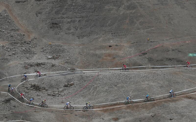 Athletes compete in the women's circuit mountain cycling gold medal final at Morro Solar during the Pan American Games in Lima, Peru.  AP