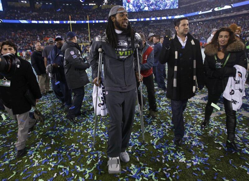 The Seahawks' Richard Sherman walks on crutches after the Super Bowl victory. He was hurt during the game. Shannon Stapleton / Reuters  