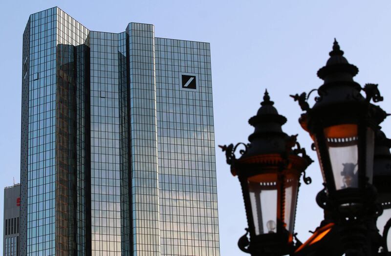 (FILES) In this file photo taken on June 4, 2018 the towers of German Company Deutsche Bank are pictured next to an old fashioned street lamp in Frankfurt am Main. German banking giant Deutsche Bank's American operations failed the US Federal Reserve's annual stress test due to "widespread and critical deficiencies" in its risk management, the central bank said June 28, 2018. The Fed gave a "conditional" pass to US investment behemoths Goldman Sachs and Morgan Stanley, even though their capital backstops sank below required levels since that was due to one-time charges tied to December's tax cuts, officials said.
 / AFP / Yann SCHREIBER
