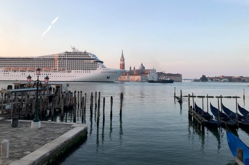 'MSC Orchestra' passes in the Giudecca Canal in Venice on June 3 as it prepares to pick up passengers. AP