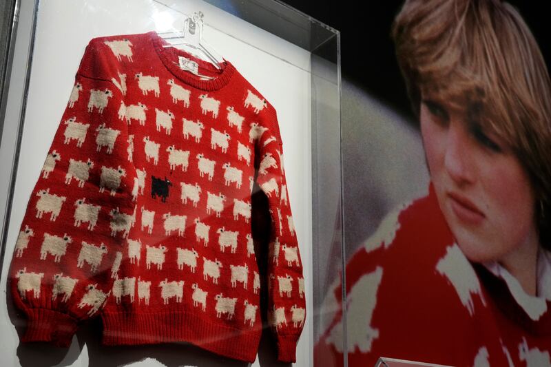 The historic black sheep jumper worn by Princess Diana on display at Sotheby's in London. AP