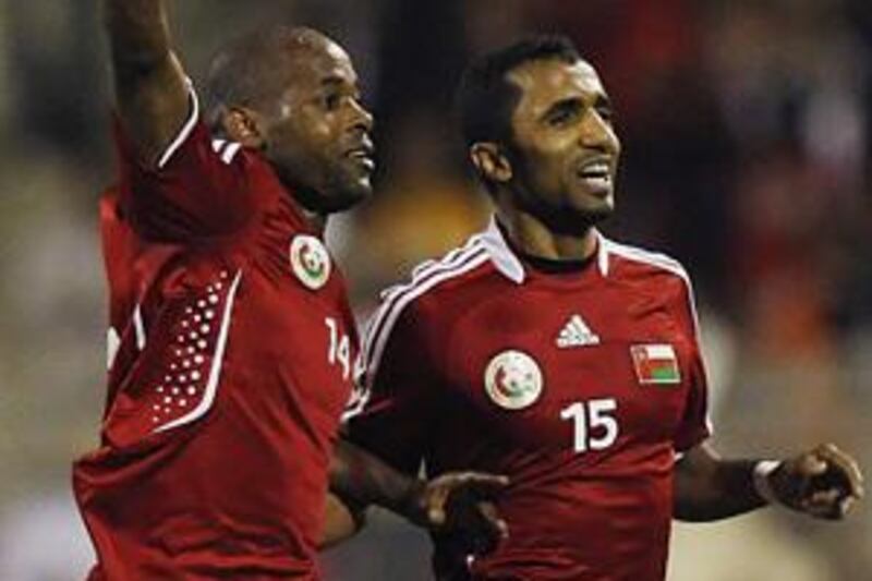 Rabea, left, celebrates his opener with Ismail al-Ajmi.
