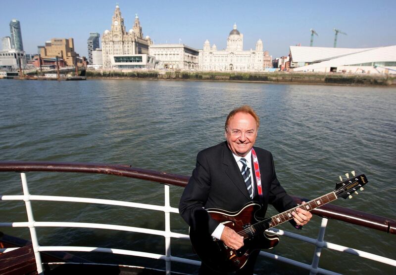 FILE - This April 20, 2009 file photo shows Gerry Marsden on board the Mersey ferry. Gerry Marsden, the British singer and lead singer of Gerry and the Pacemakers, who was instrumental in turning a song from the Rodgers and Hammerstein musical â€œCarouselâ€ into one of the great anthems in the world of football, has died. He was 78. (Dave Thompson/PA via AP, File)