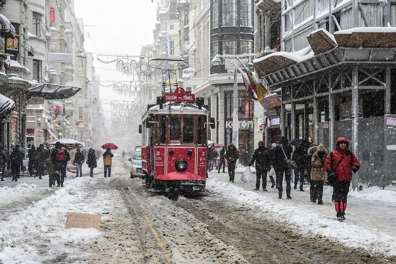 Istiklal Avenue after snowfalls in Istanbul. A snowstorm brought the city to a standstill after nearly 40cm fell overnight. Yasin Akgul / AFP 