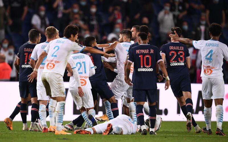 Paris Saint-Germain and Marseille players scuffle at the end of the match. AFP