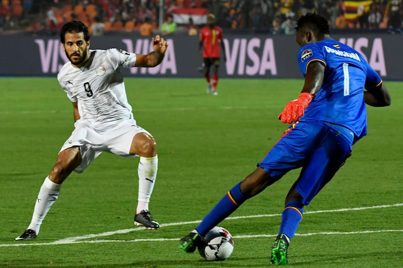 Egypt forward Marwan Mohsen, right, challenges Uganda goalkeeper Robert Odongkara. AFP