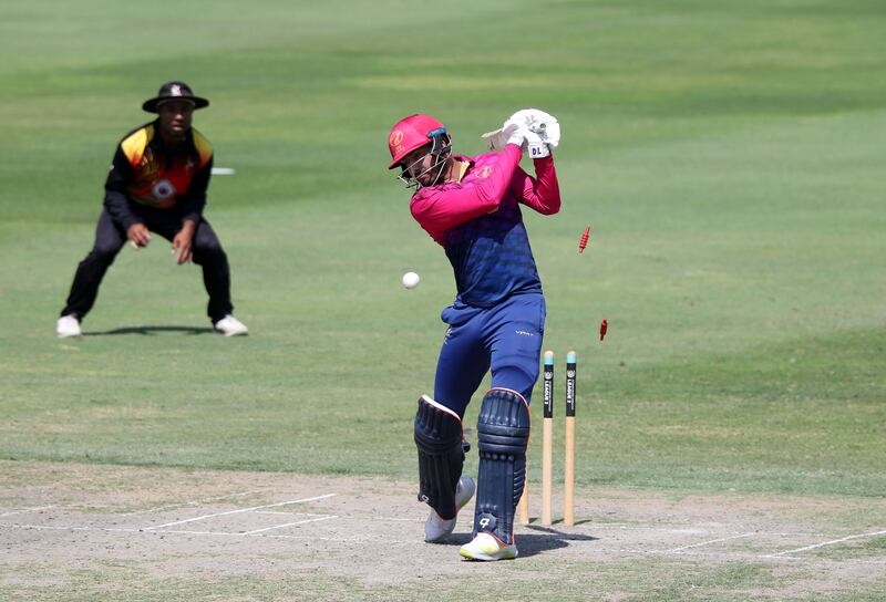 UAE's Junaid Siddique is bowled by PNG's Riley Hekure