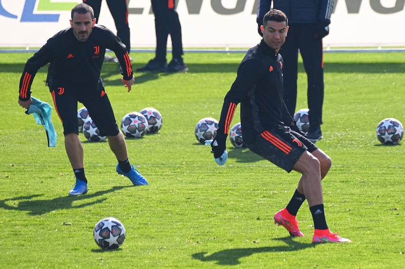 Leonardo Bonucci, left, and Cristiano Ronaldo training in Turin ahead of Juventus' Uefa Champions League last-16 first-leg against Porto. AFP