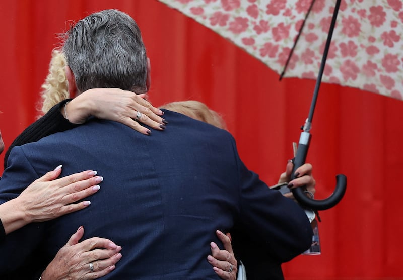 An embrace for Kier Starmer, leader of Britain's Labour Party, at a by-election victory event for Sarah Edwards, newly elected MP for Tamworth, at Tamworth Football Stadium, Staffordshire, central England, on October 20, 2023.  Reuters