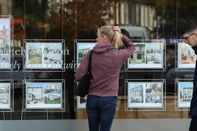 A woman looks in an Estate Agent window. Skipton's research shows eight in ten tenants say the cots of living crisis means they are unable to save for a deposit to secure a mortgage. (Photo by Dan Kitwood/Getty Images)