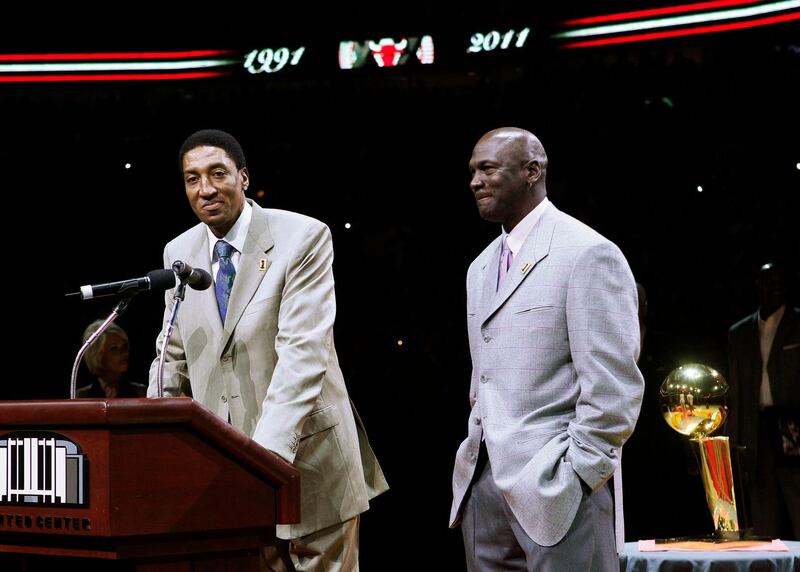 Former Chicago Bull Scottie Pippen, left, addresses the crowd as Michael Jordan and teammates from their 1990-91 season celebrate the 20th anniversary of the Bulls' first NBA championship. AP