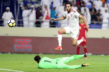 UAE's Ali Mabkhout scores during the World Cup 2022 Qualifier against Indonesia. Chris Whiteoak / The National