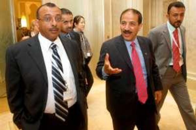 Hisham Sharaf Abdullah (C), assistant of Yemen's minister of planning and international cooperation, leaves following the opening ceremony of the international donor conference for Yemen in Abu Dhabi at on March 29, 2010. Yemen told international donors in Abu Dhabi that it urgently needs promised financial aid to combat poverty and unemployment. AFP PHOTO/KARIM SAHIB *** Local Caption ***  191346-01-08.jpg