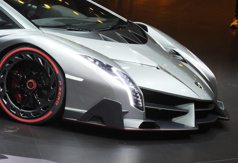 epa03609787 The Lamborghini Veneno is introduced by Volkswagen on the eve of the first press day of the 83rd Geneva International Motor Show, in Geneva, Switzerland, 04 March 2013. The Geneva International Motor Show will open its doors to the public from March 7-17, 2013 at PALEXPO in Geneva.  EPA/ULI DECK *** Local Caption ***  03609787.jpg