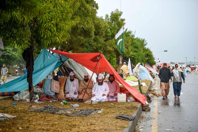 Supporters of Islamic political party Jamiat Ulema-e-Islam (JUI) pray in their makeshift shelter during an anti-government "Azadi (Freedom) March" in Islamabad. AFP