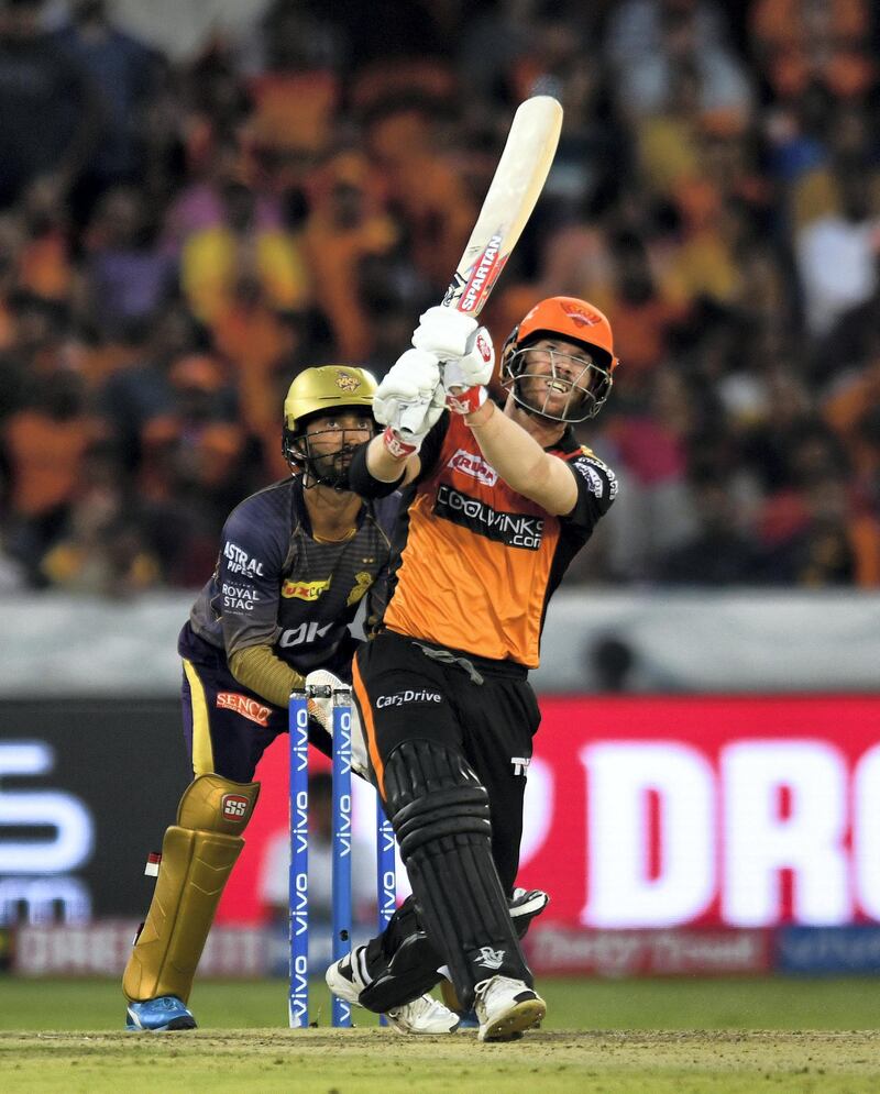 Sunrisers Hyderabad cricketer David Warner (R) plays a shot during the 2019 Indian Premier League (IPL) Twenty20 cricket match between Sunrisers Hyderabad and Kolkata Knight Riders at the Rajiv Gandhi International Cricket Stadium in Hyderabad on April 21, 2019. (Photo by NOAH SEELAM / AFP) / ----IMAGE RESTRICTED TO EDITORIAL USE - STRICTLY NO COMMERCIAL USE-----