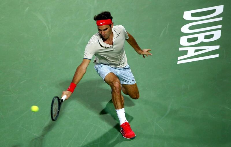 Federer on his way to a 6-2, 6-7, 6-3 win over Stepanek. Marwan Naamani / AFP