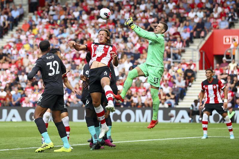 SOUTHAMPTON, ENGLAND - AUGUST 17: Adrian of Liverpool saves a shot from Jannik Vestergaard of Southampton during the Premier League match between Southampton FC and Liverpool FC at St Mary's Stadium on August 17, 2019 in Southampton, United Kingdom. (Photo by Warren Little/Getty Images)