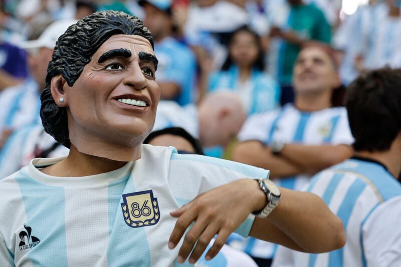 Even this Diego Maradona mask could have been left red-faced after Argentina succumbed 2-1 to Saudi Arabia in a shock result in Lusail. AFP