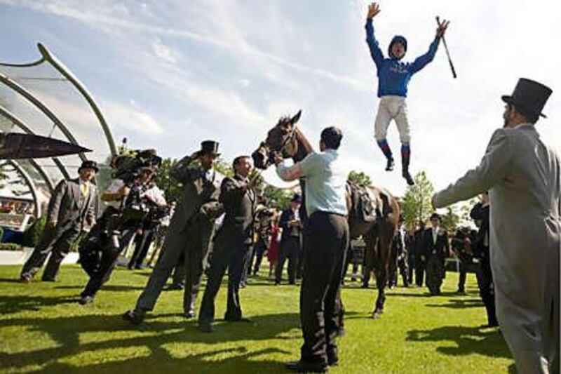Frankie Dettori leaps from Hibaayeb after winning the Ribblesdale Stakes yesterday as owner Sheikh Mohammed bin Rashid, far right, watches on. The victory continued Godolphin's run of success at Ascot.
