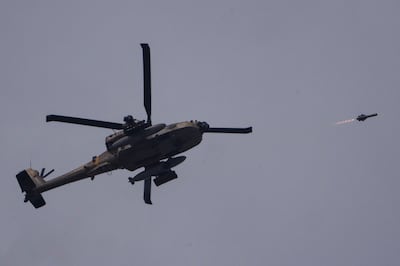 An Israeli Apache helicopter fires a missile towards the Gaza Strip from southern Israel. AP