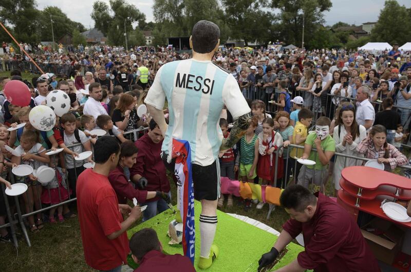A birthday cake including a statue depicting Lionel Messi is seen during a party organised by the village of Bronnitsy. AFP