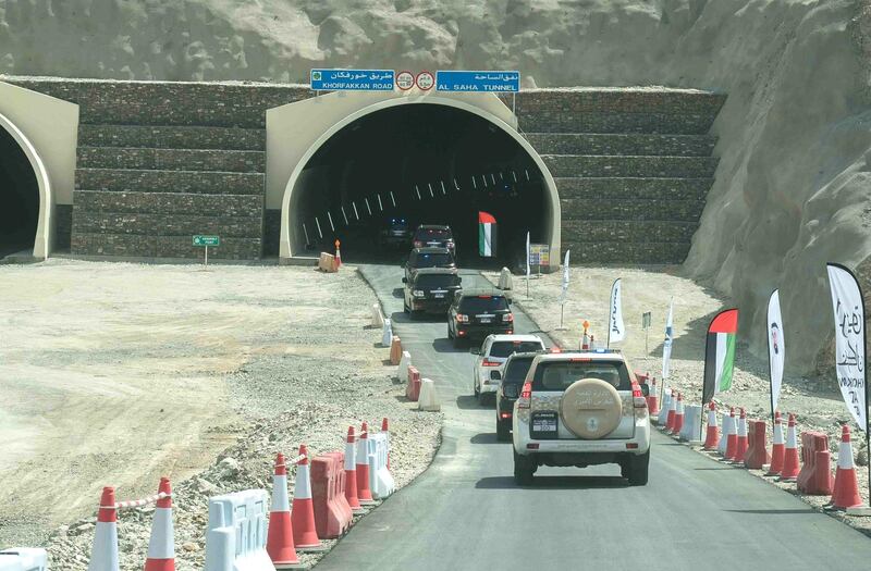The Ruler of Sharjah is driven through one of the five tunnels that comprise the new road. Wam