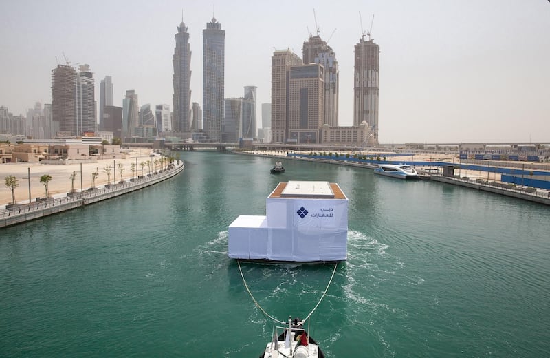 The first water home makes its way up Dubai Water Canal. Courtesy Dubai Properties
