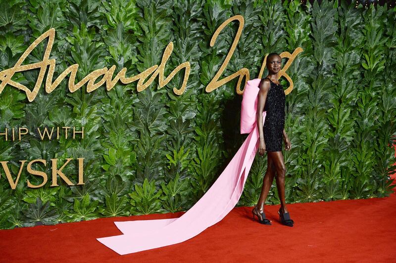 LONDON, ENGLAND - DECEMBER 10:  Alek Wek arrives at The Fashion Awards 2018 In Partnership With Swarovski at Royal Albert Hall on December 10, 2018 in London, England.  (Photo by Jeff Spicer/BFC/Getty Images for BFC)