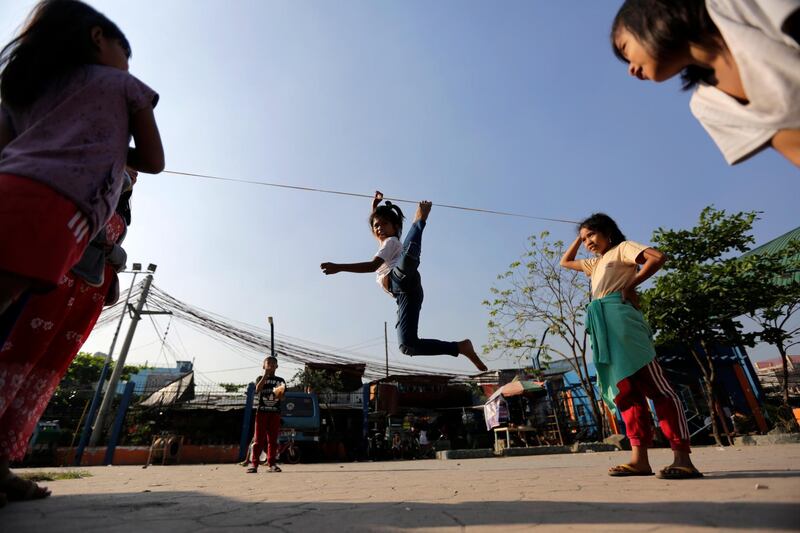 Filipino children play at a slum area suspected by the government as the ground zero of a measles outbreak in Manila, Philippines. EPA