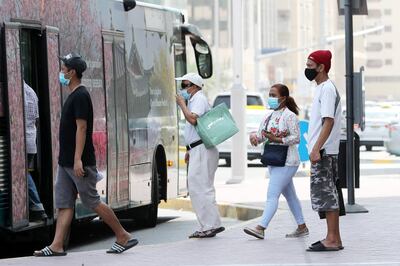 ABU DHABI, UNITED ARAB EMIRATES , June 1 – 2020 :- People wearing protective face mask as a preventive measure against the spread of coronavirus at the bus stop in Abu Dhabi. UAE government lifts the coronavirus restriction for the residents and businesses around the country. (Pawan Singh / The National) For News/Stock
 
